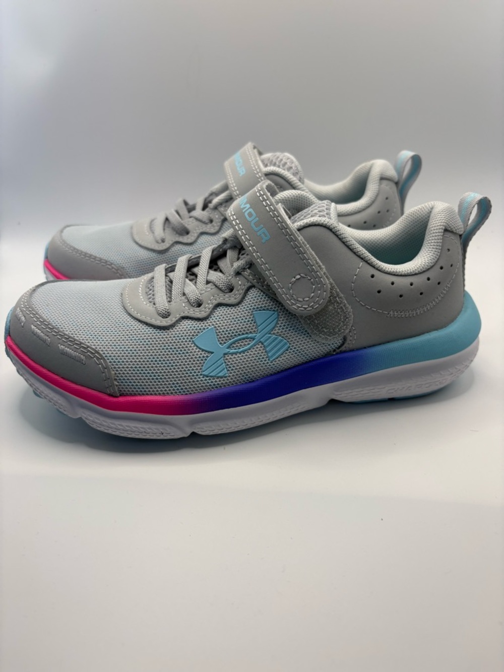 Under Armour Youth Light Gray Sneakers with Pink & Blue Accents